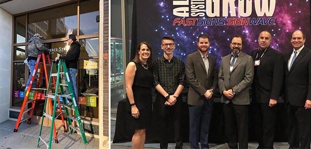 Mark Glenn's team works hard applying a sign and poses together at a FASTSIGNS convention